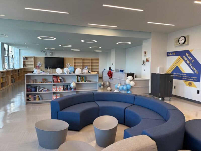 Media and research center with curved blue seating and ring lights