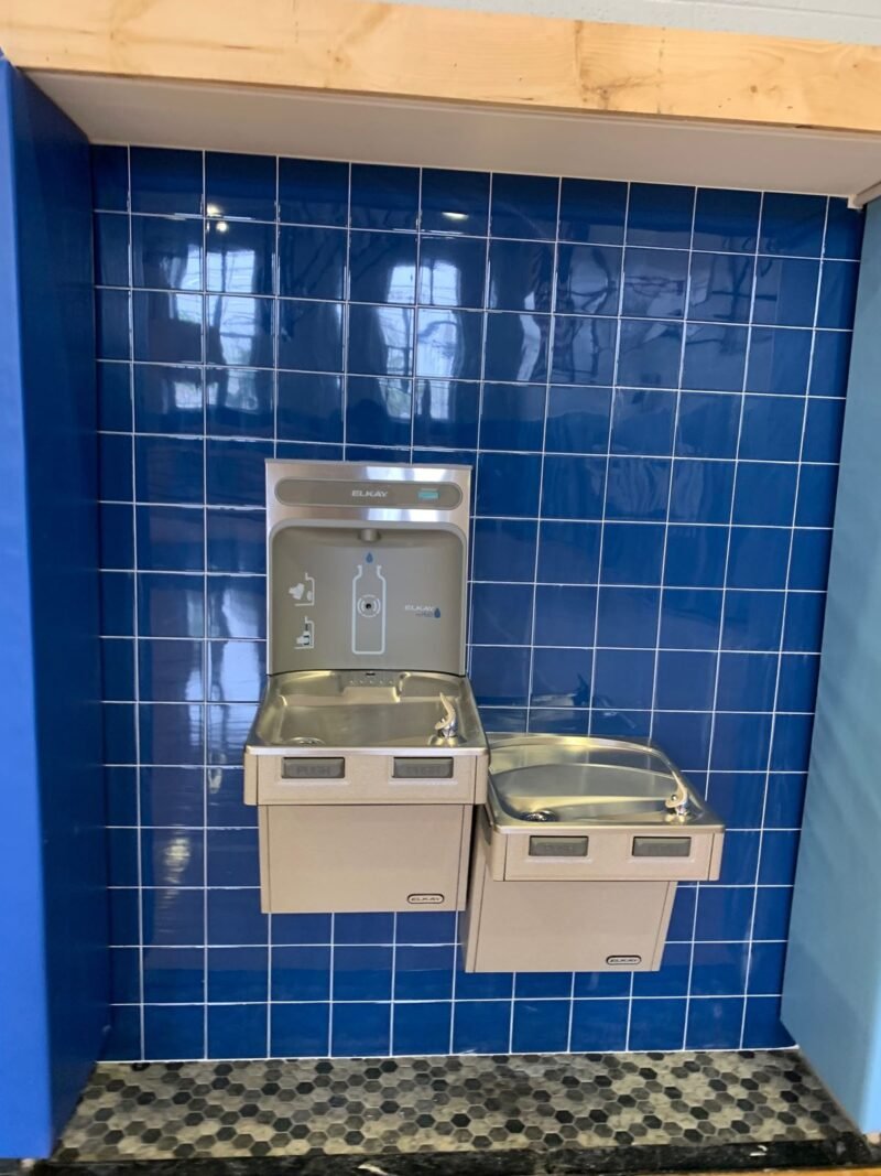 Bottle-filling hydration station set in blue glazed tile